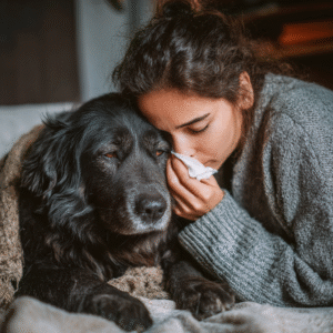 A concerned owner comforts their pet experiencing a persistent dog cough.
